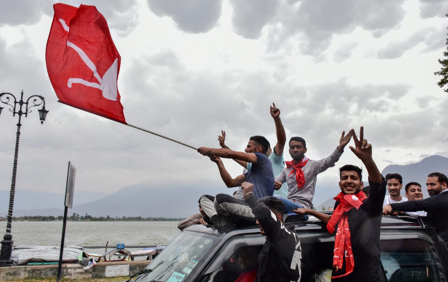 After winning the assembly election, supporters of the National Conference party celebrate on October 8, 2024, in Srinagar in Jammu and Kashmir, India.