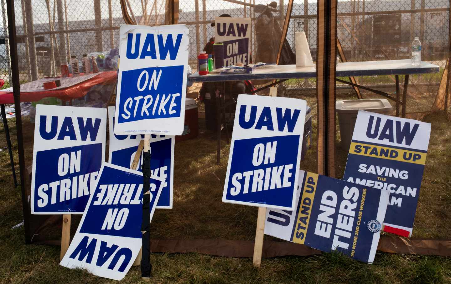 Signs wait ready for use as United Auto Workers members and supporters picket outside the Stellantis NV Toledo Assembly Complex in Toldeo, Ohio, on September 22, 2023.