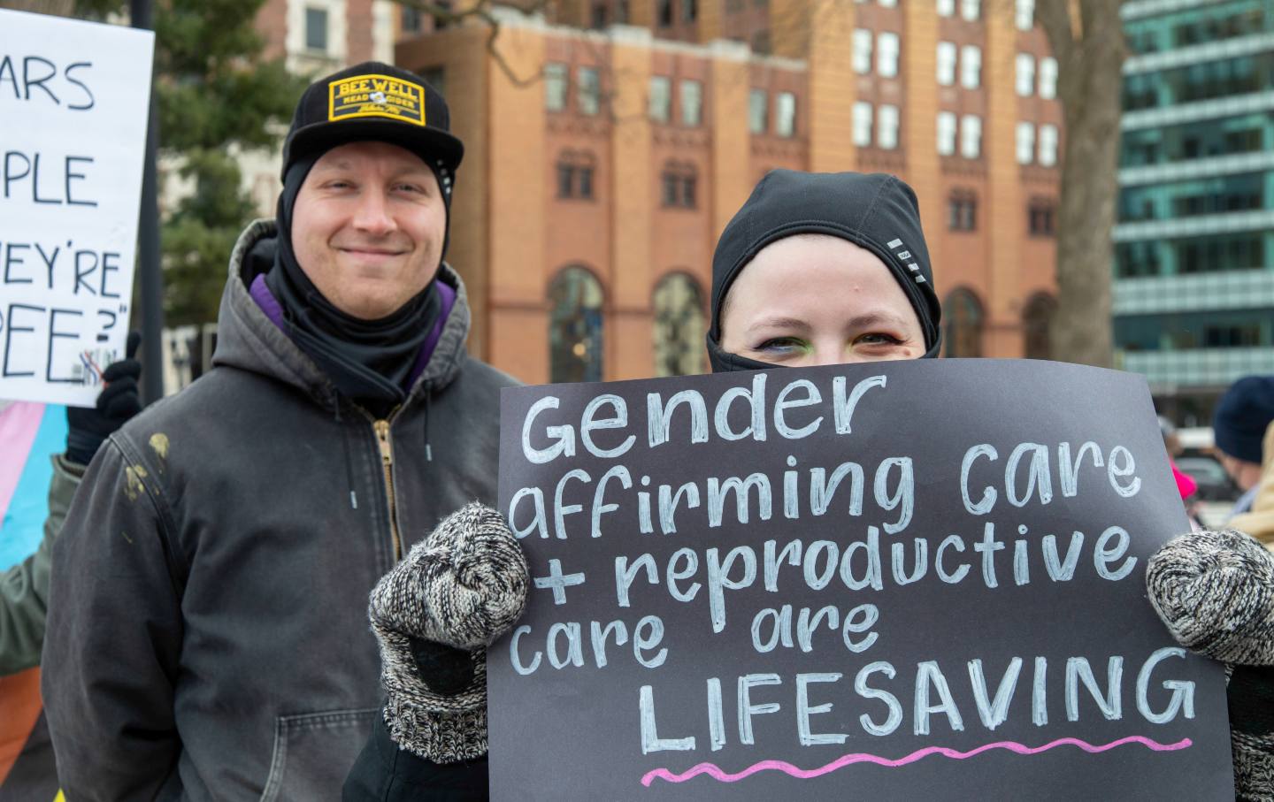 People rally in Lansing, Michigan, to oppose President Trump, Elon Musk, and Project 2025.