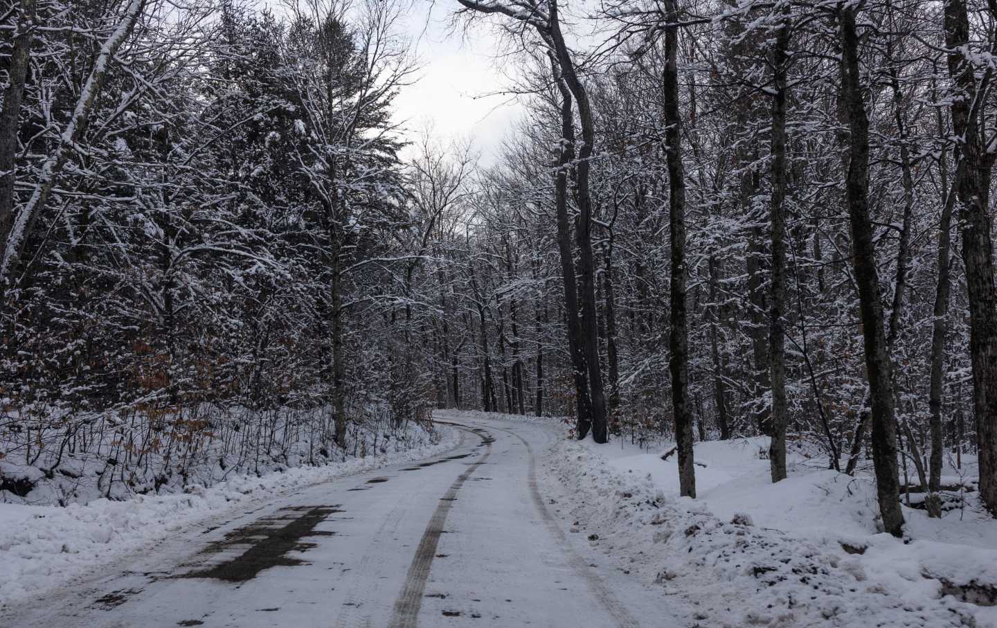 A backcountry road is covered in recent snow, February 2, 2024, in the Catskills Mountain region of New York.