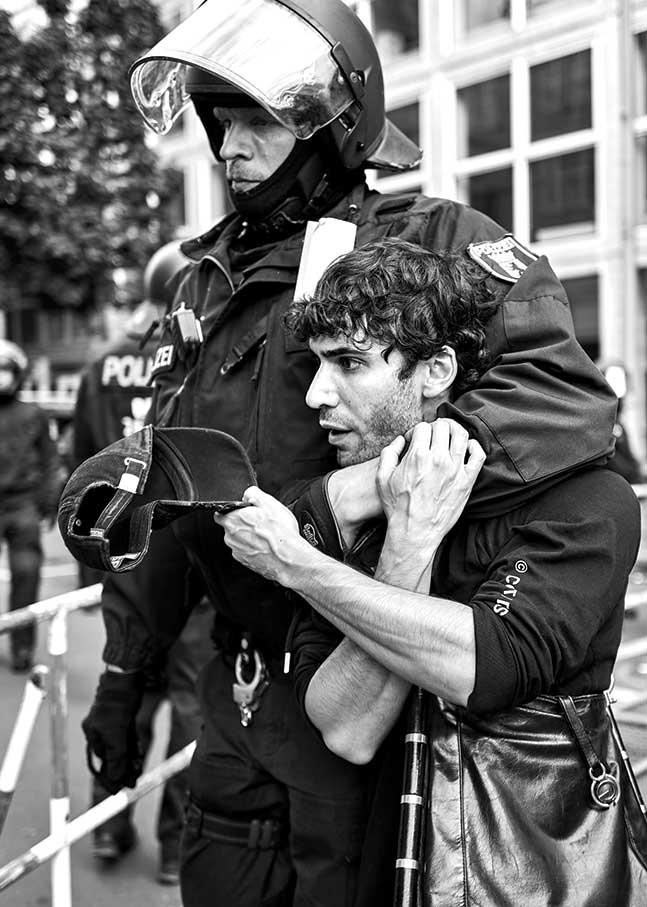 Police remove a pro-Palestinian demonstrator at Berlin’s Cold War–era Checkpoint Charlie landmark.