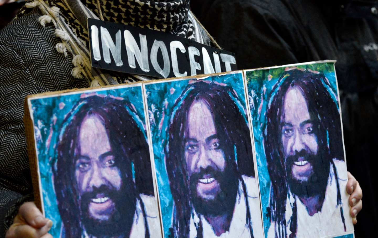 Two dozen rallied to call on Philadelphia district Attorney Larry Krasner to not appeal a recent decision of PA Supreme Court Justice Tucker, at a rally in Center City, Philadelphia, Pennsylvania, on December 12, 2018.