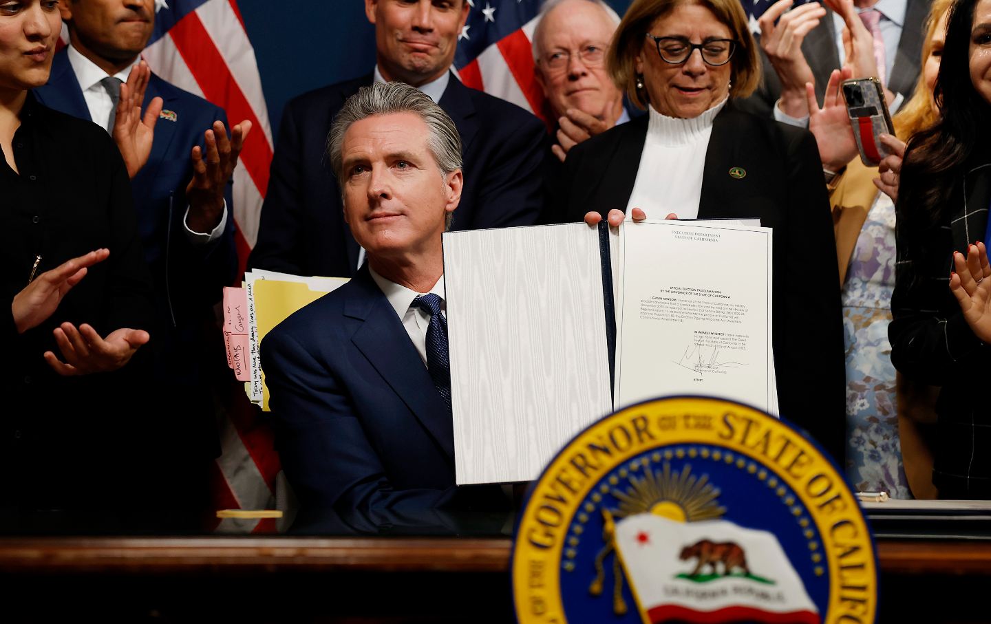 California Governor Gavin Newsom signs bills related to redrawing the state’s congressional maps on August 21, 2025, in Sacramento, California.