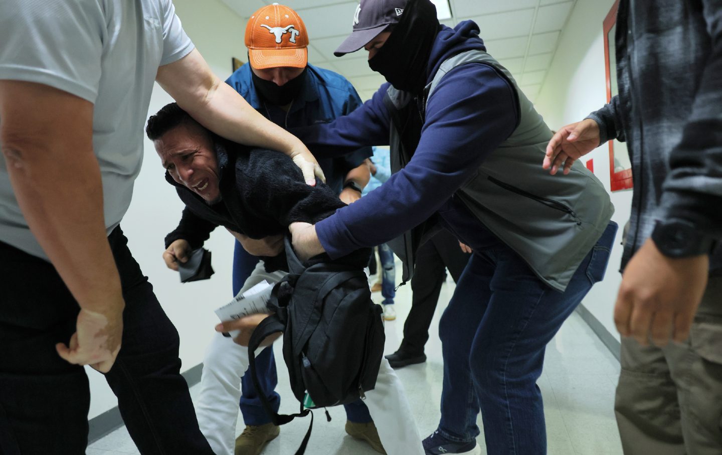 A man seeking asylum from Colombia is detained by federal agents as he attends an immigration court hearing at the Jacob K. Javits Federal Building on October 27, 2025 in New York City.