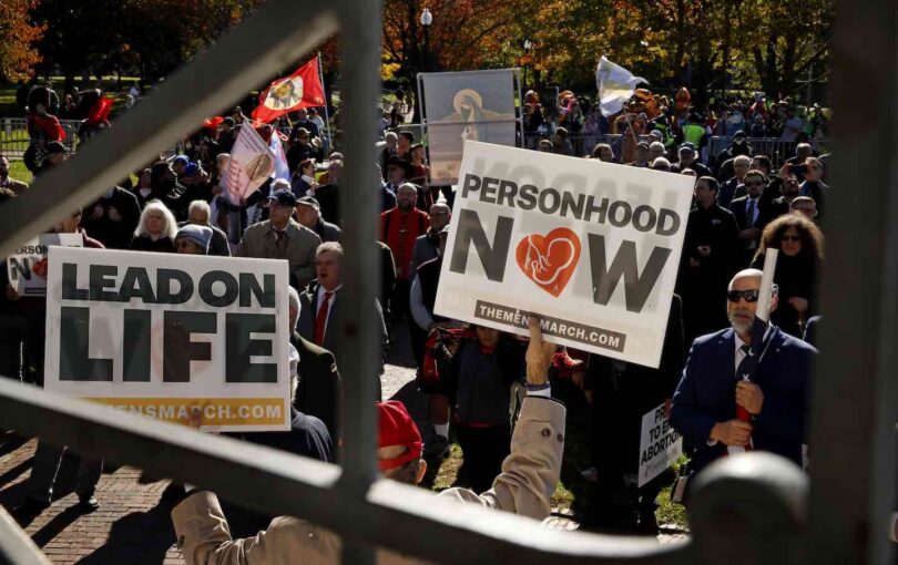 Demonstrators at the Parkman Bandstand during the National Men's March to Abolish Abortion and Rally for Personhood on November 1, 2025.