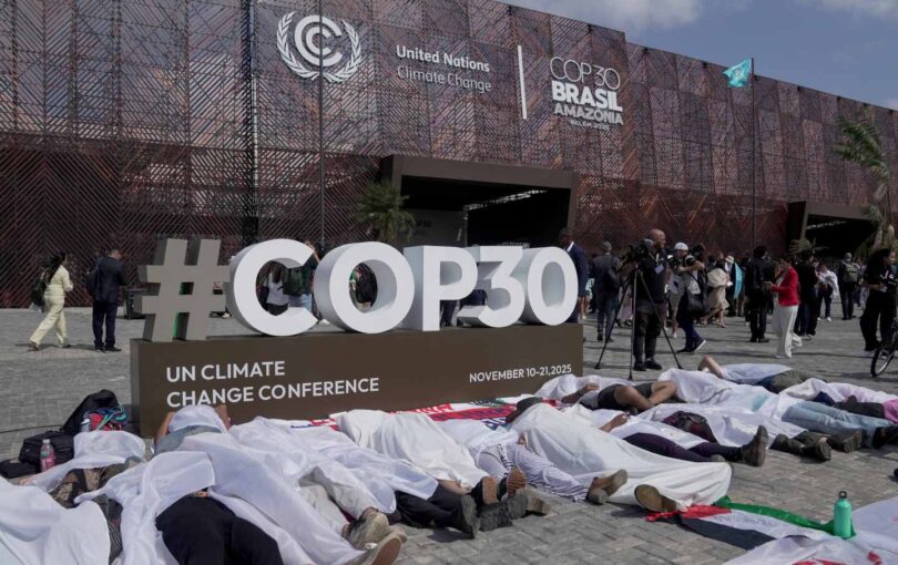 People participate in a demonstration in front of the main entrance of COP30 in Belém, Brazil, on November 10, 2025.