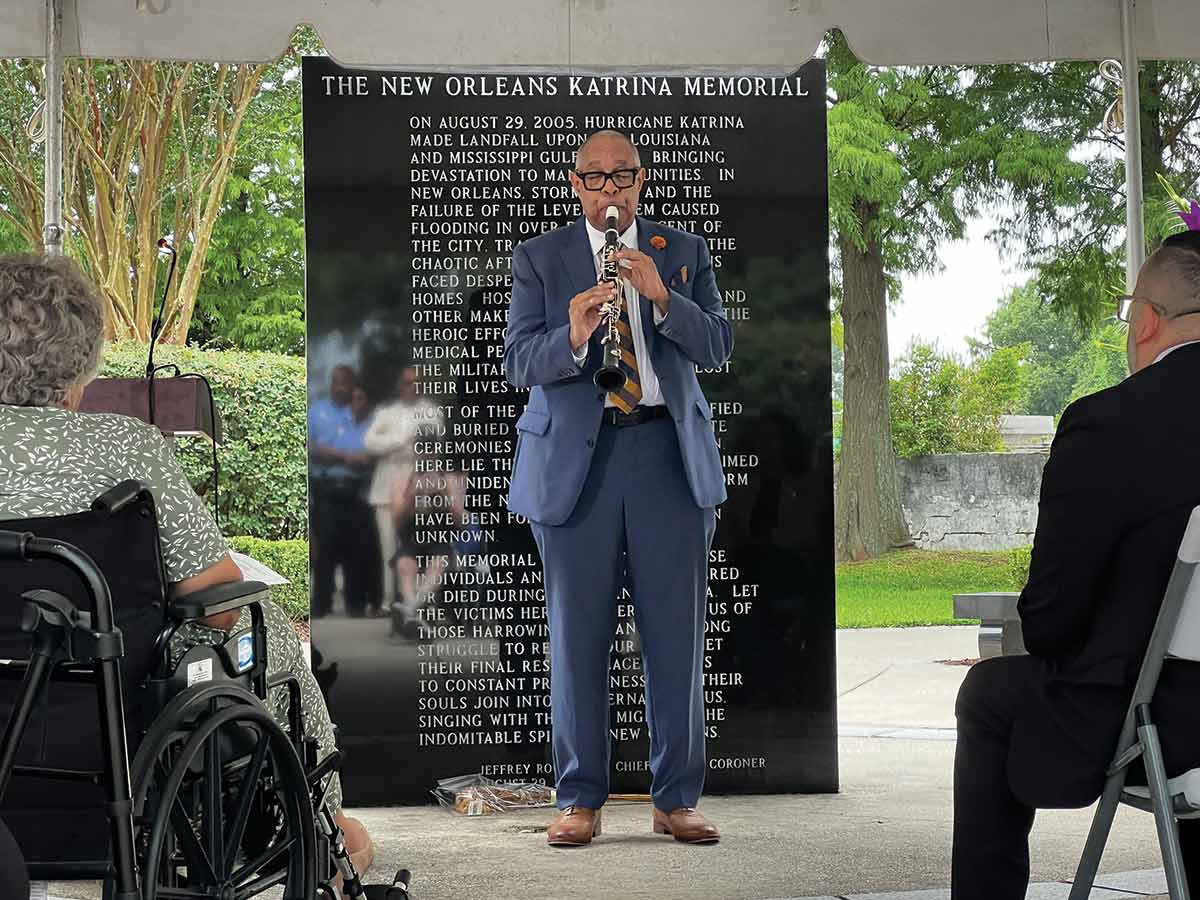 The clarinetist Michael White plays a hymn near the Hurricane Katrina memorial at Charity Hospital Cemetery No. 1.
