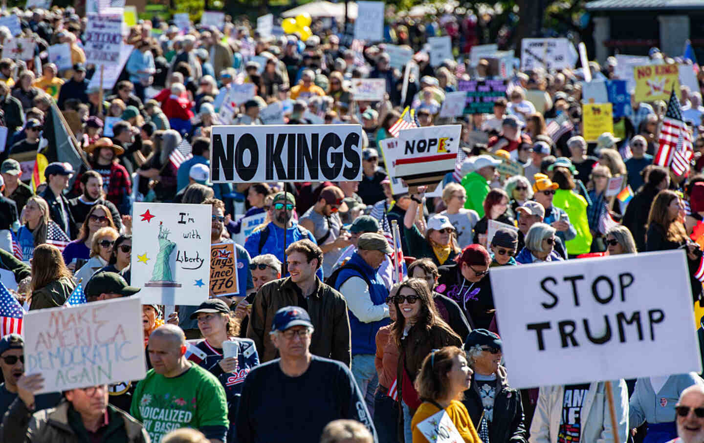 People participate in a “No Kings” national day of protest in Boston, Massachusetts, on October 18, 2025.