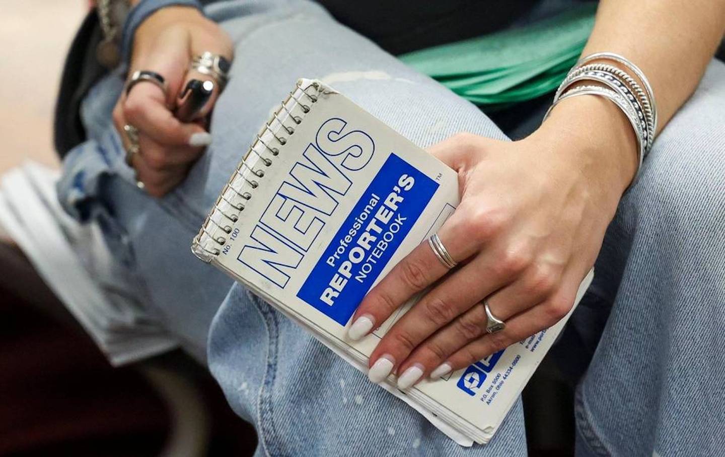 Kentucky Kernel editor in chief holds a reporter’s notebook during a staff meeting at the University of Kentucky.