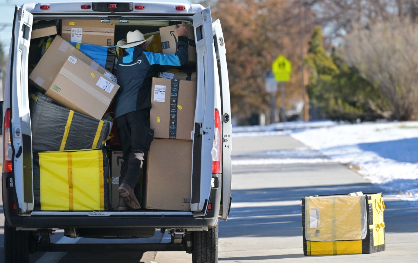Amazon delivery driver Leah Cross has alleged that Amazon’s delivery quota amounts to workplace discrimination. Here, a Lakewood, Colorado, driver makes deliveries in 2023.