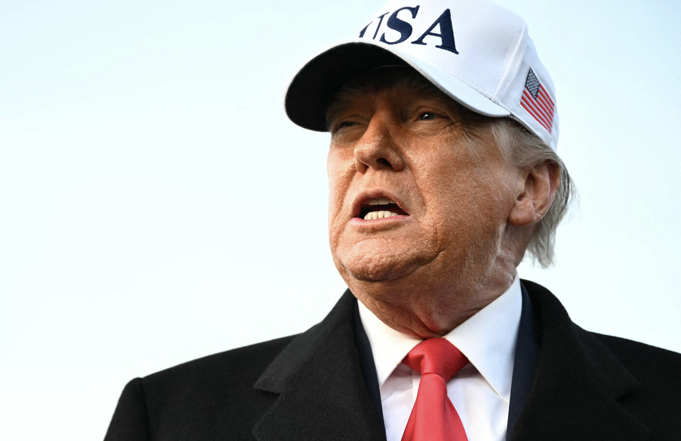 Donald Trump speaks to the press upon returning to Joint Base Andrews in Maryland.