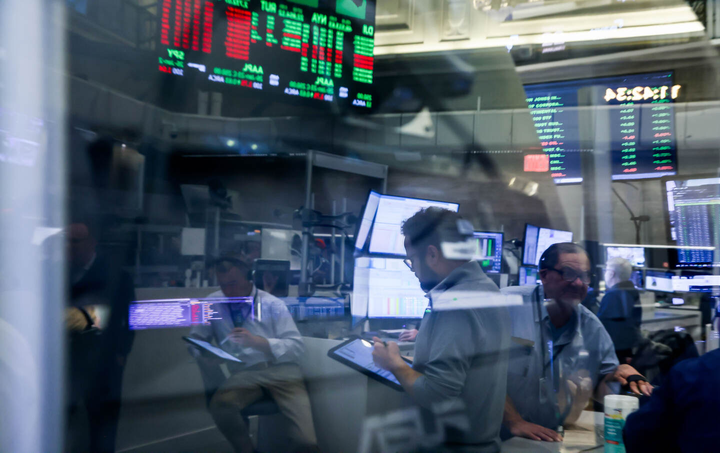 Traders work on the floor of the American Stock Exchange (AMEX) in New York.