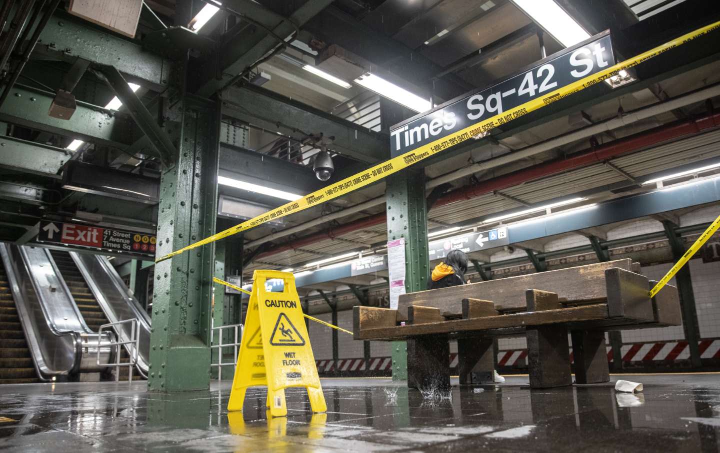 A flooded floor is blocked off in the 42nd Street Times Square subway station during a rain storm in New York.