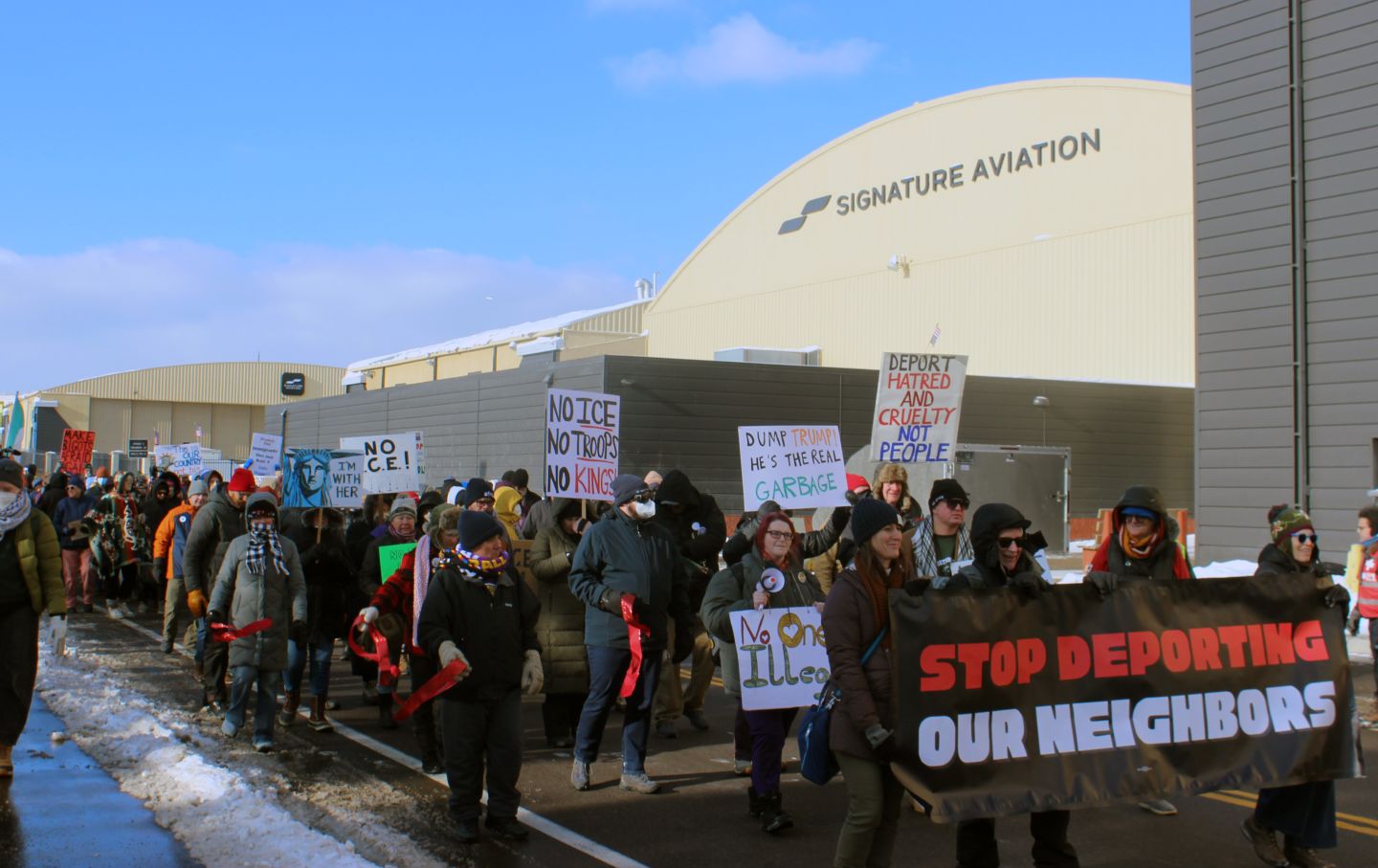 Workers with SEIU Local 26 and UNITE HERE Local 17 marched and rallied at the Minneapolis–St. Paul airport alongside community members on December 3, 2026. They were for an end to deportation flights conducted by private companies such as Signature Aviation.