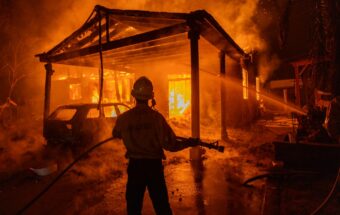 Homes burn as powerful winds drive the Eaton Fire on January 7, 2025, in Pasadena, California.