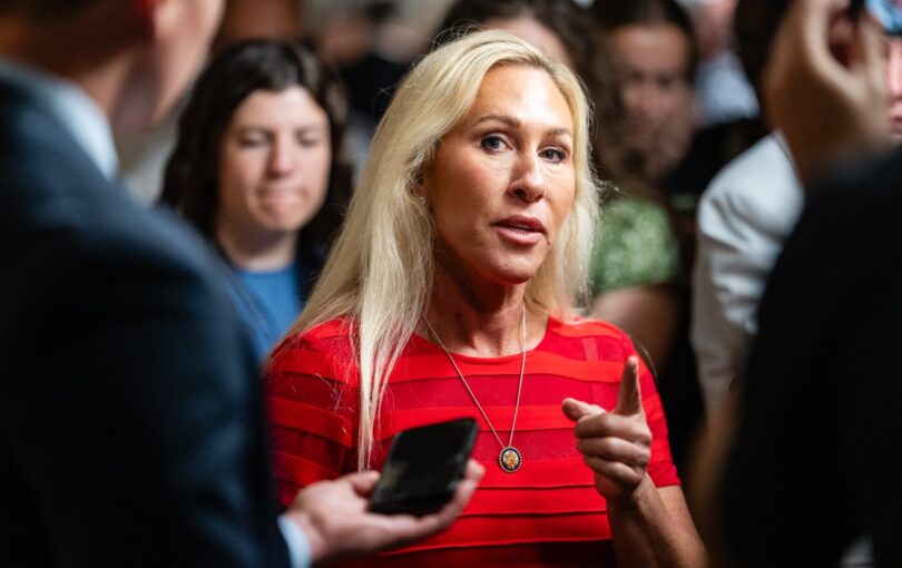 Representative Marjorie Taylor Greene talks with reporters in the Capitol on April 8, 2025.