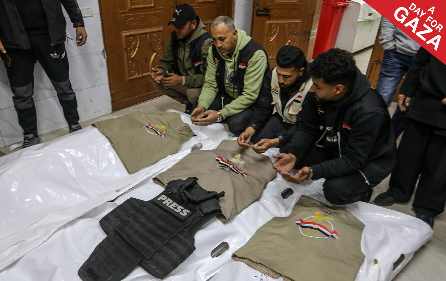 Relatives and colleagues bid farewell to Palestinian journalists Abdel Raouf Shaath, Mohammed Qashta, and Anas Ghoneim, who were killed in an Israeli air strike.