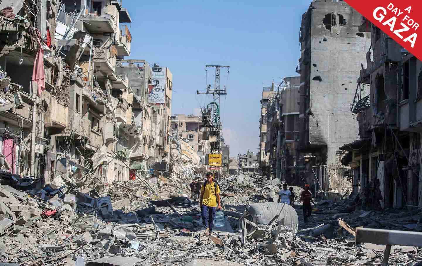 People inspect damage and remove items from their homes following Israeli air strikes on April 7, 2024 in Khan Yunis, Gaza.