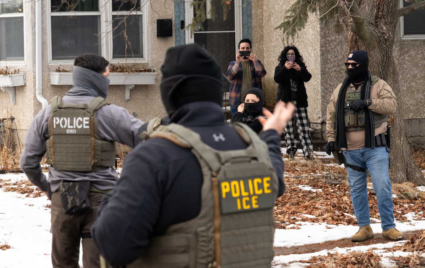 Observers film ICE agents on February 5, 2026, in Minneapolis, Minnesota.