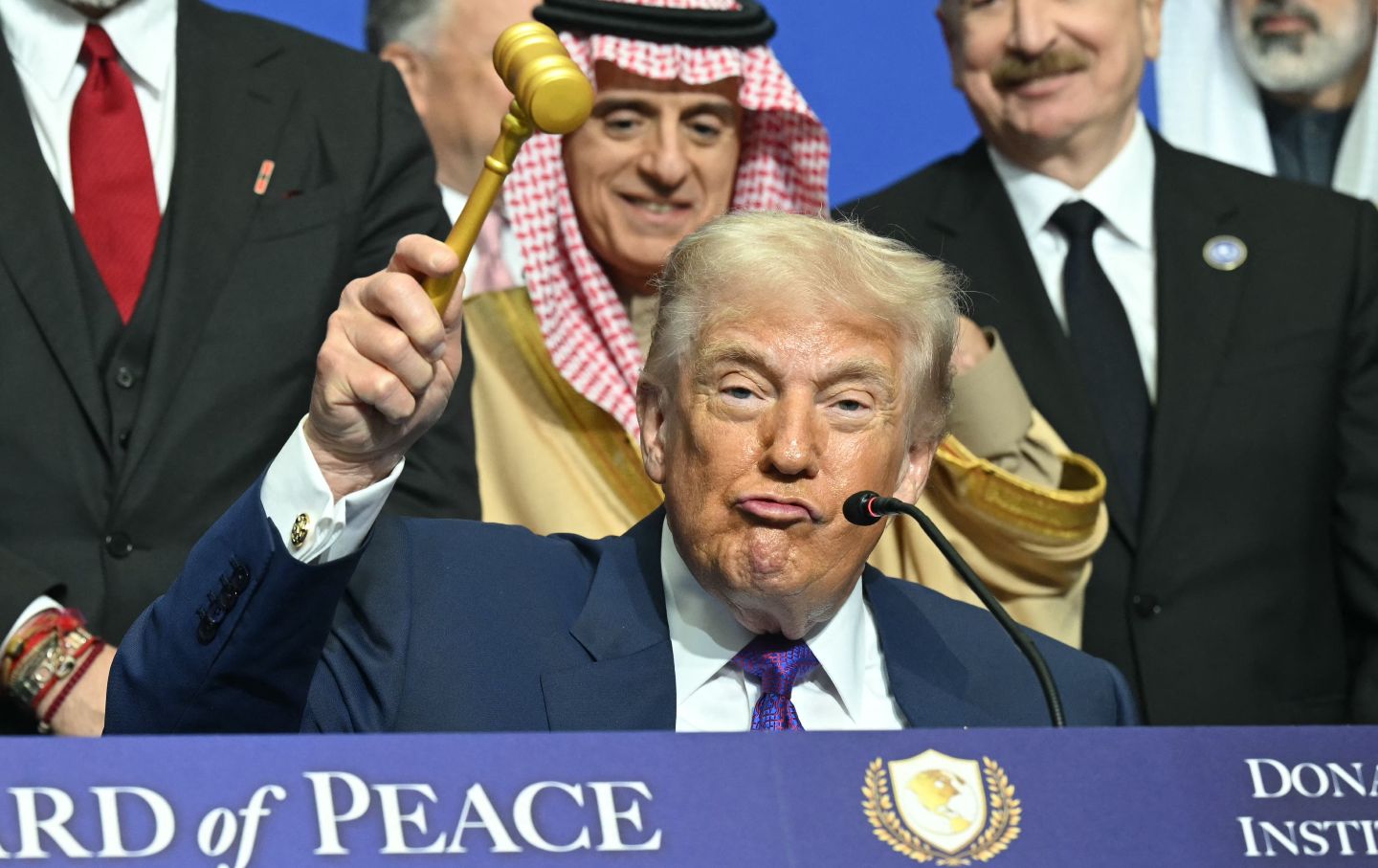 US President Donald Trump wields a gavel during the signing ceremony at the inaugural meeting of his “Board of Peace” at the US Institute of Peace in Washington, DC, on February 19, 2026.