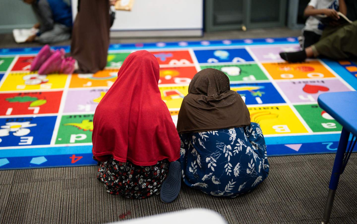 Children read at ABC Learning Center Inc. in Minneapolis. A viral video showed a YouTuber knocking on doors of Somali-run daycares and claiming there were no children there, accusing the owners of defrauding the state. This daycare was featured in the video but did not allow the YouTuber in to the building.