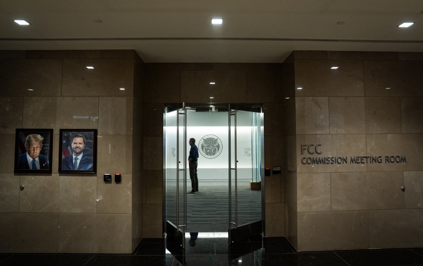 Official portraits of President Donald Trump and Vice President JD Vance displayed at the Federal Communications Commission headquarters in Washington, DC, on Wednesday, February 18, 2026.