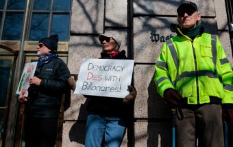 NewsGuild members are joined by other protesters during a rally outside the Washington Post office building on February 5, 2026, in Washington, DC.