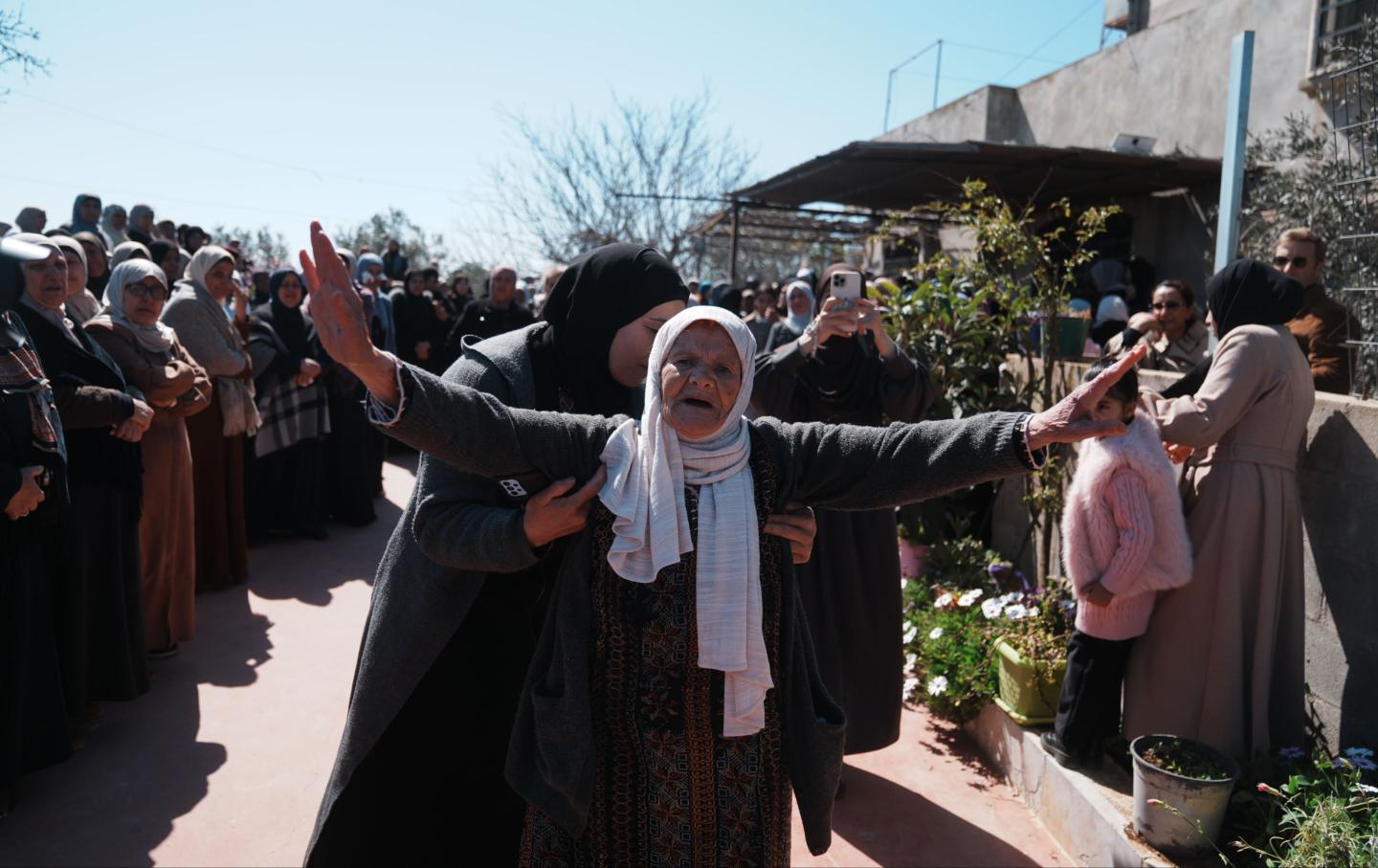 Family members and relatives mourn the loss of two brothers who were killed by Israeli settlers during a raid on the town of Qaryut in the southern West Bank, on March 3, 2026.
