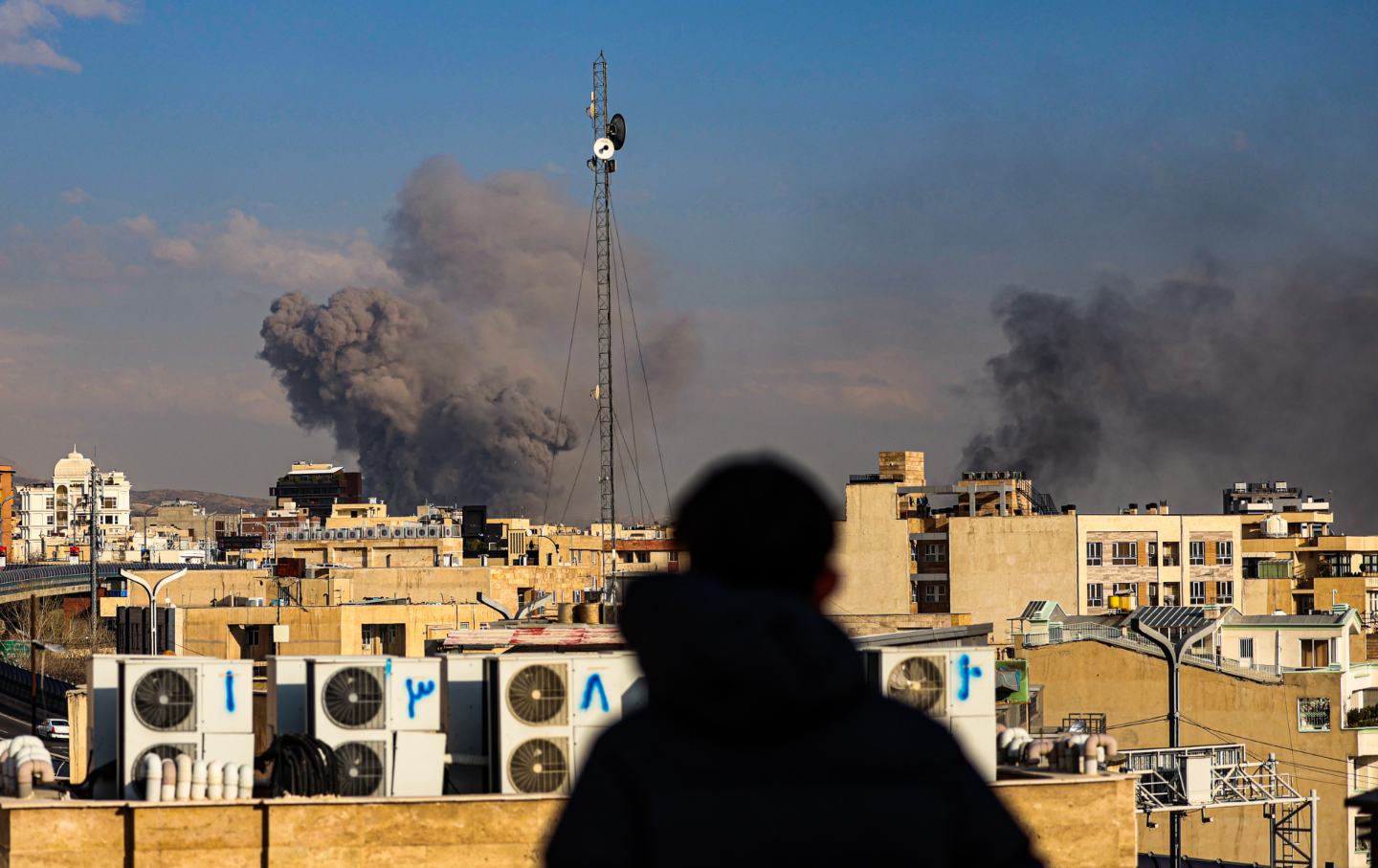 Tehran with smoke visible in the distance after explosions were reported in the city, on March 02, 2026