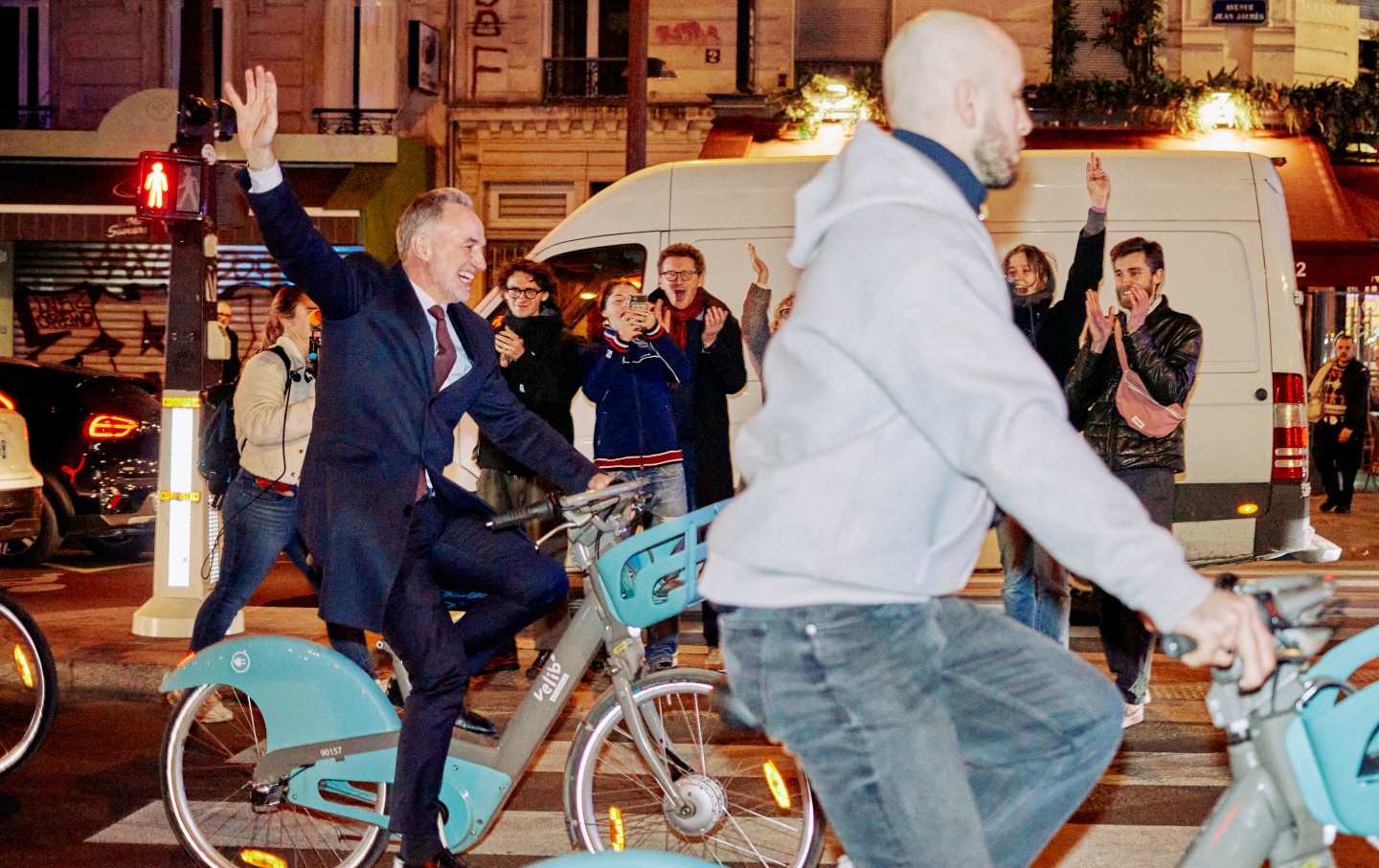 Socialist Party Paris mayoral candidate Emmanuel Gregoire rides a Velib’ public bike-sharing bicycle to Paris town hall after his victory in France's 2026 municipal elections, on March 22, 2026.