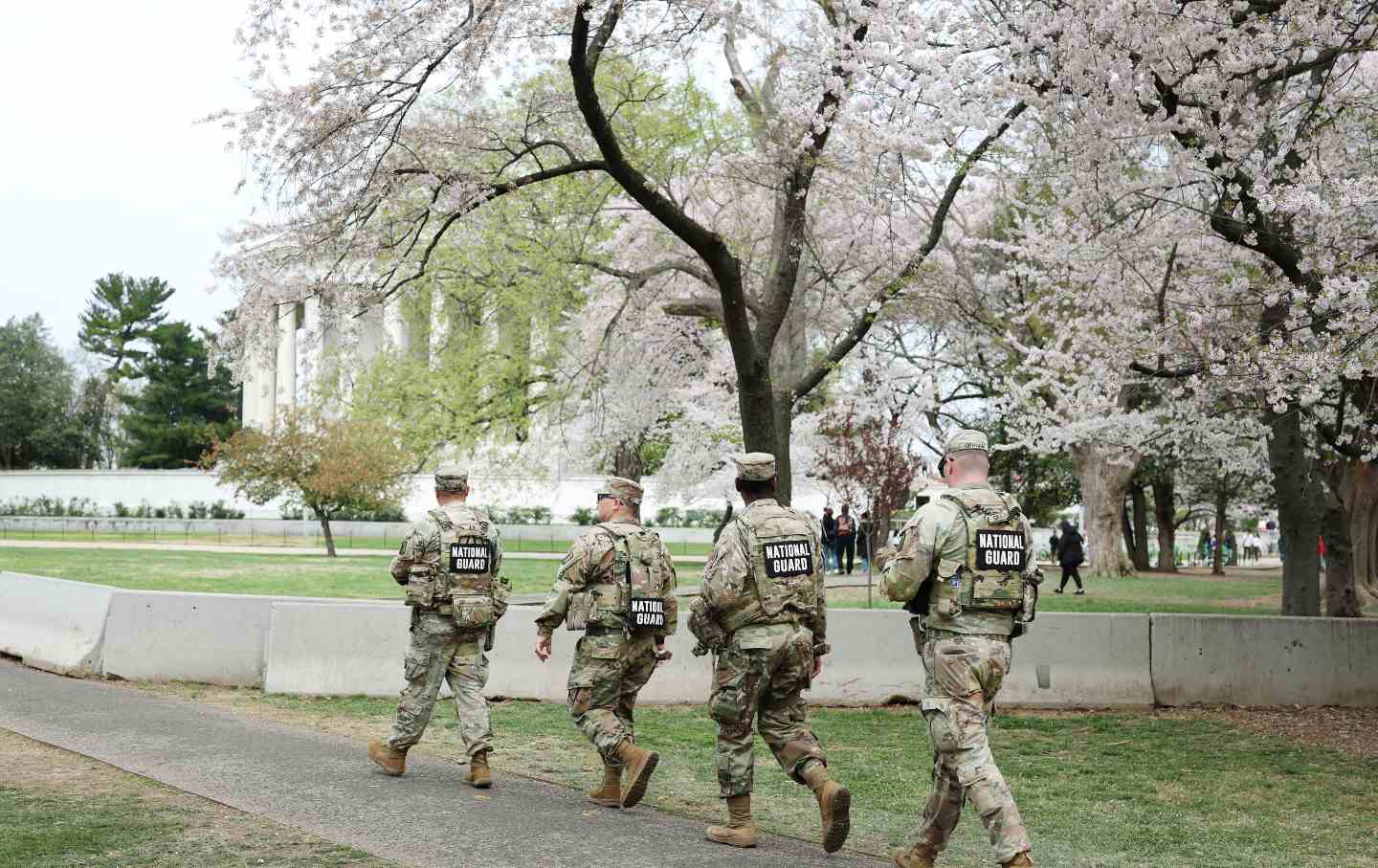 Members of the National Guard patrol the Tidal Basin as tourists visit the Cherry Blossoms in Washington, DC, on March 30, 2026.