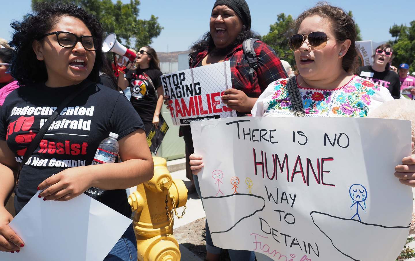 Protesters led by a coalition of interfaith religious leaders demonstrate against US immigration policy outside the Otay Mesa Detention Center in San Diego, California.