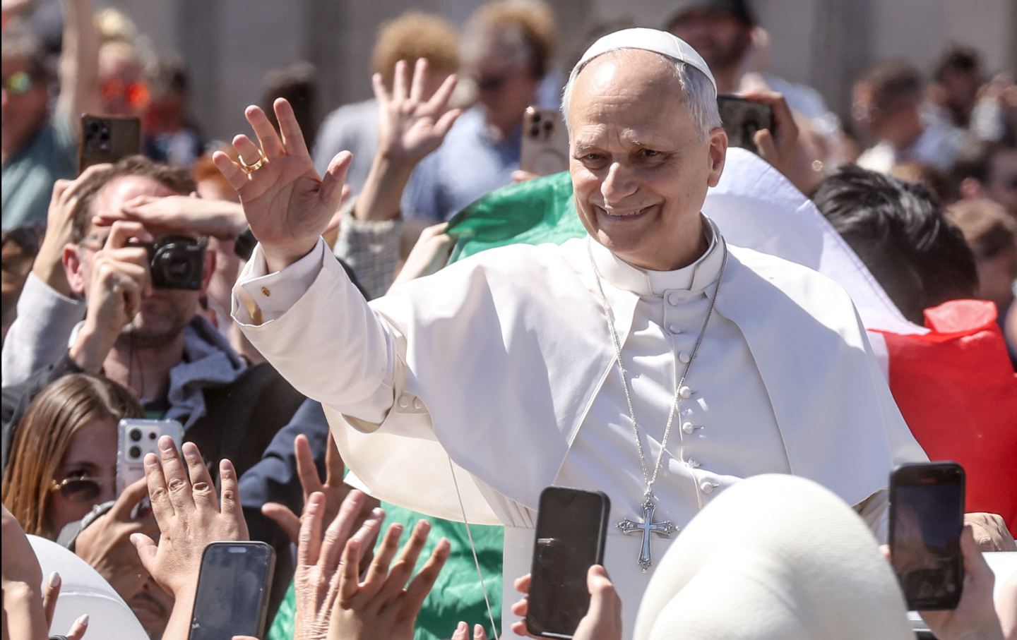 Pope Leo XIV greets the faithful at the end of the Easter mass, on April 5, 2026, in Vatican City.