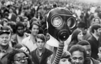A gas mask is held aloft at the inaugural Earth Day protest in New York City, New York, on April 22, 1970.
