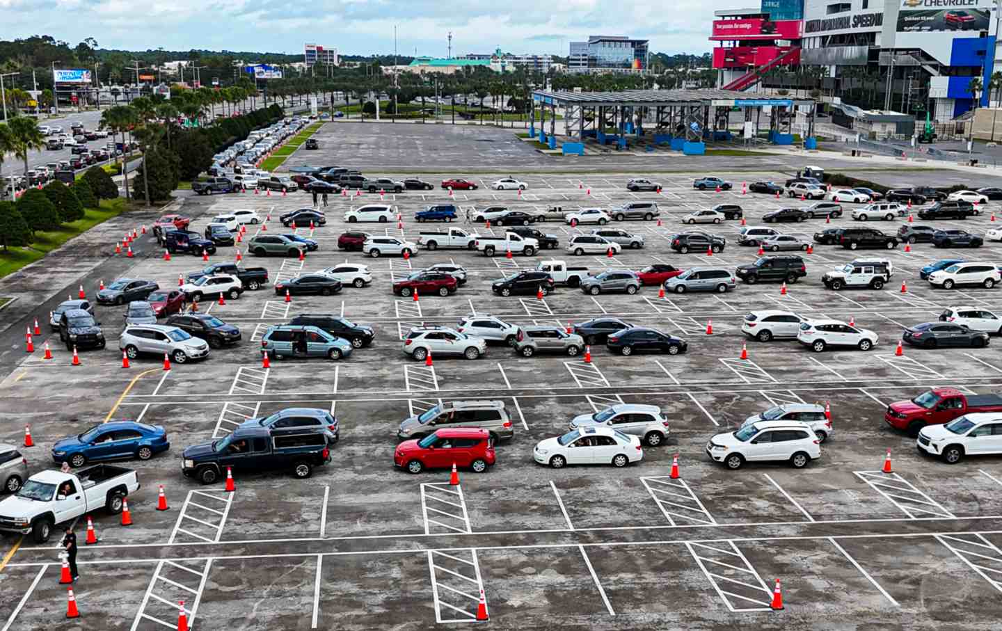 Residents of Daytona Beach, Florida, line up in their cars during a free food distribution for recipients of the Supplemental Nutrition Assistance Program on November 9, 2025.