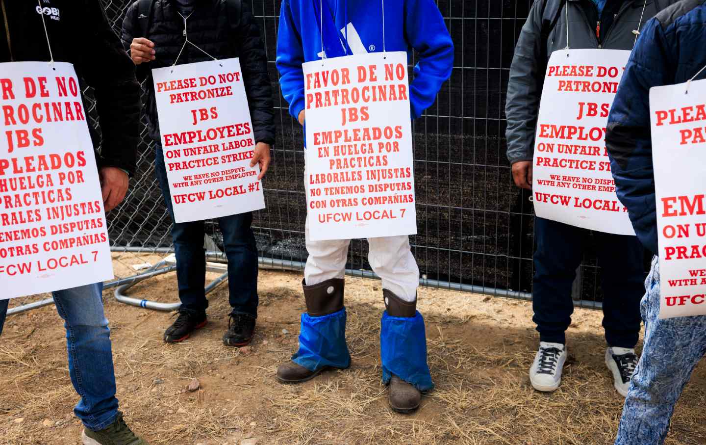 Workers picket outside of the JBS meatpacking plant on March 16, 2026, in Greeley, Colorado.
