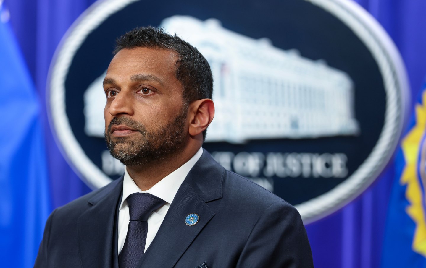 Kash Patel listens as Acting Attorney General Todd Blanche speaks at a press conference on April 28, 2026 at the Department of Justice in Washington, DC.
