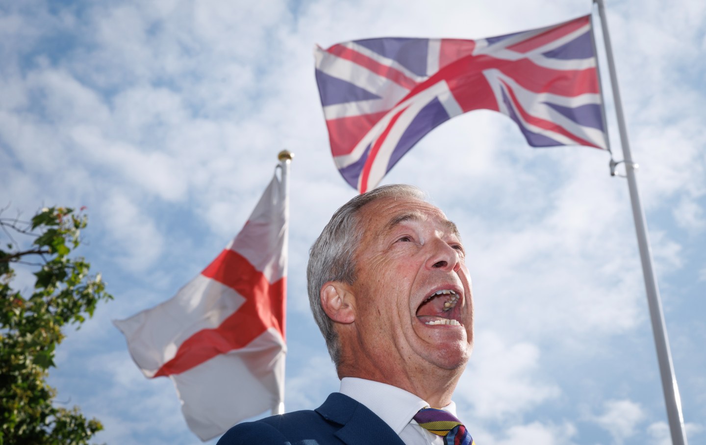 Reform UK leader Nigel Farage speaks with media outside Havering Town Hall following the 2026 local election results on May 8, 2026 in Romford, England.
