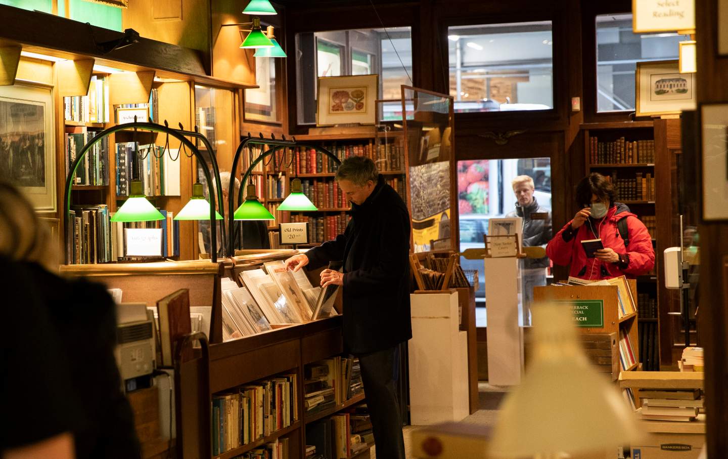 Customers shop for books at the Argosy Book Store, New York City’s oldest independent bookstore, founded in 1925.