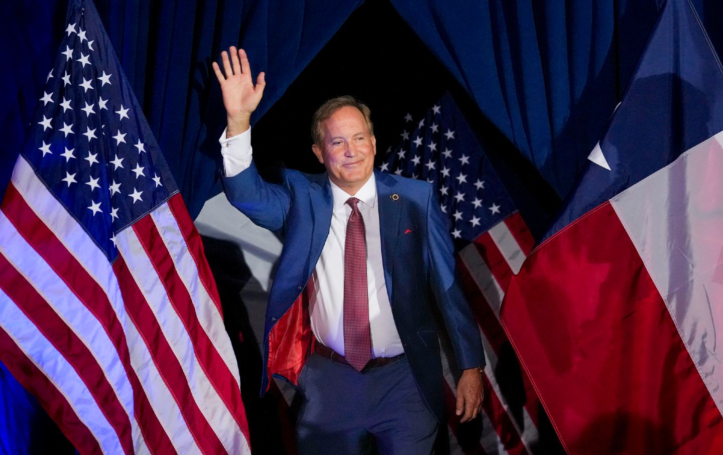 Texas Attorney General and US Senate candidate Ken Paxton waves to supporters as he takes the stage during a primary runoff election night watch party in Plano, Texas, on May 26, 2026.