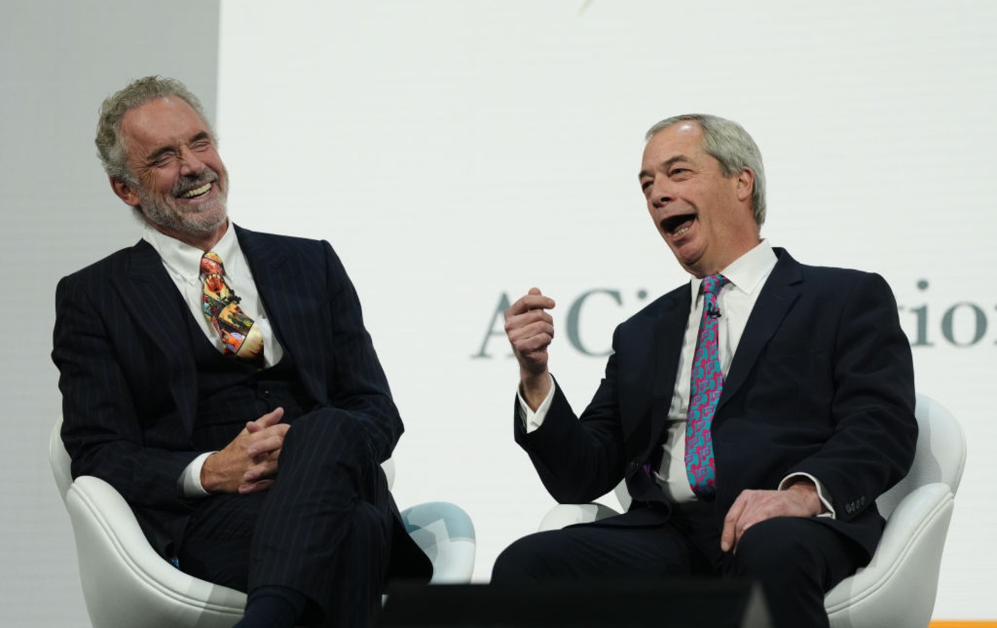 Reform UK leader Nigel Farage (right) is interviewed by Jordan Peterson at the annual conference of the Alliance for Responsible Citizenship in London, February 18, 2025.