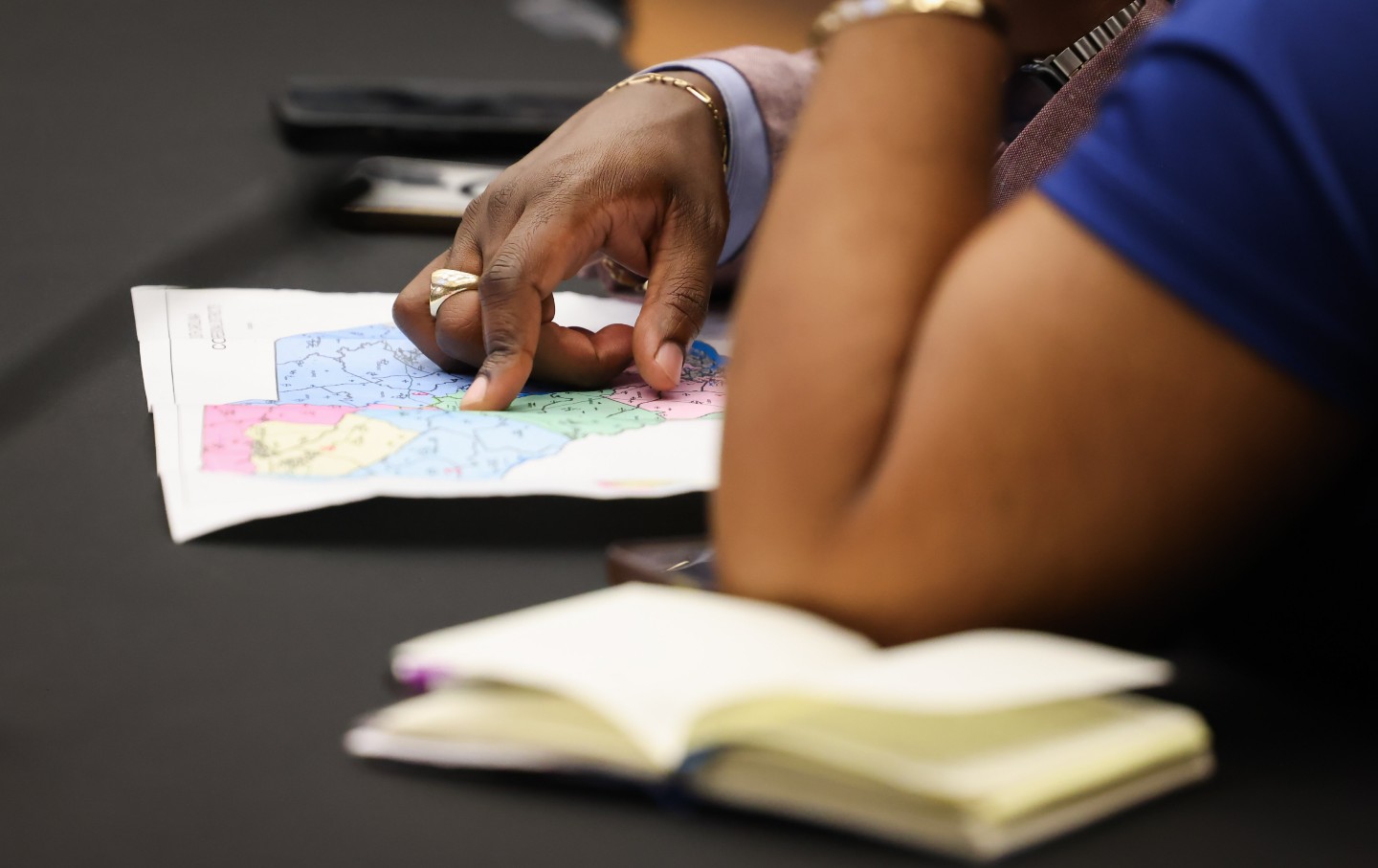 State Representative Hamilton Grant, a Democrat from South Carolina, and State Representative Annie McDaniel, a Democrat from South Carolina, look over a proposed Congressional map during a meeting in the Blatt Building at the South Carolina State Capitol in Columbia, South Carolina, US, on Friday, May 8, 2026. Some observers worry that the recent wave of gerrymandering across the country will help deepen polarization among voters and entrench lawmakers in a way that makes them less accountable to constituents.