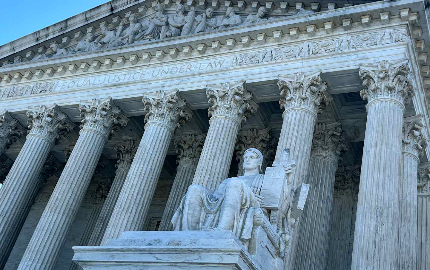 The statue “Guardian or Authority of Law,” above the west front plaza of the U.S. Supreme Court.