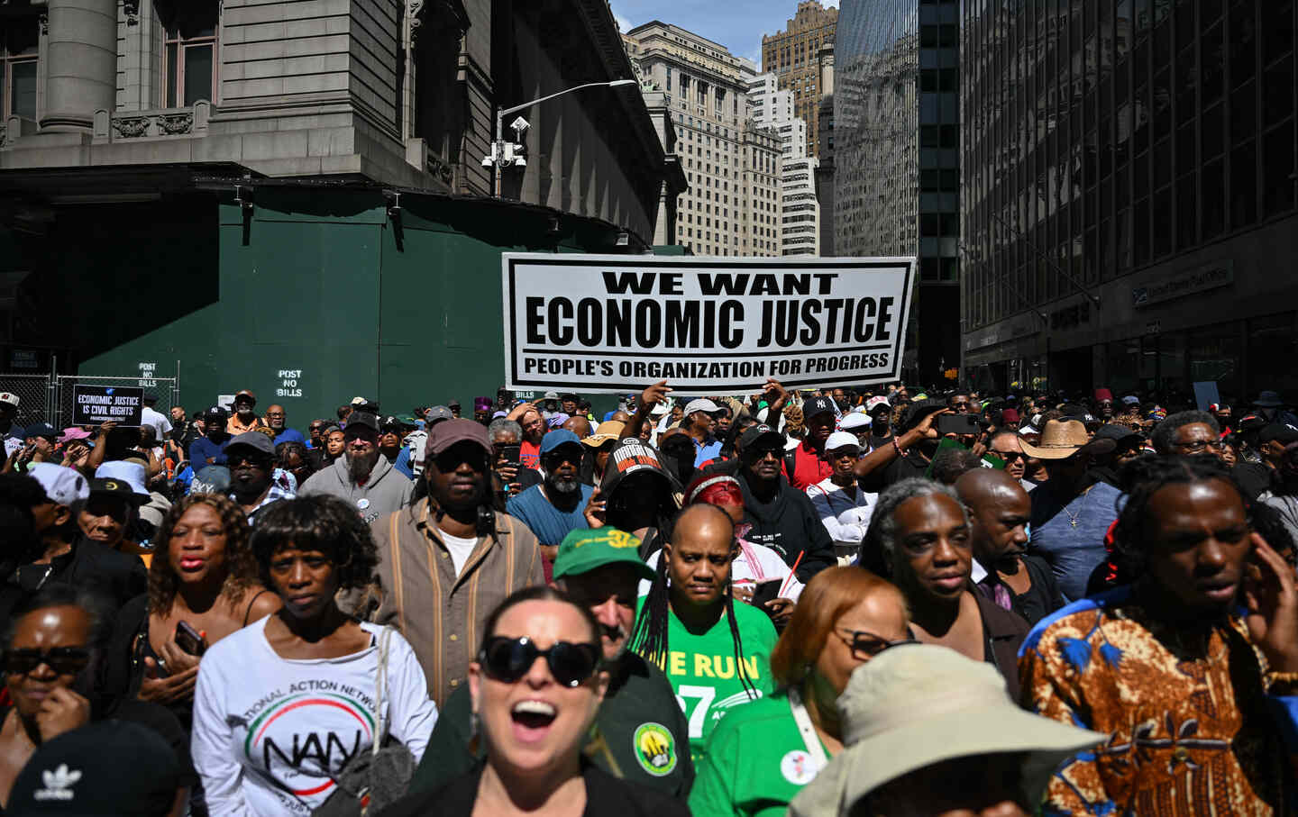 Demonstrators participate in a “March on Wall Street” to call for economic justice on August 28, 2025, in New York City.
