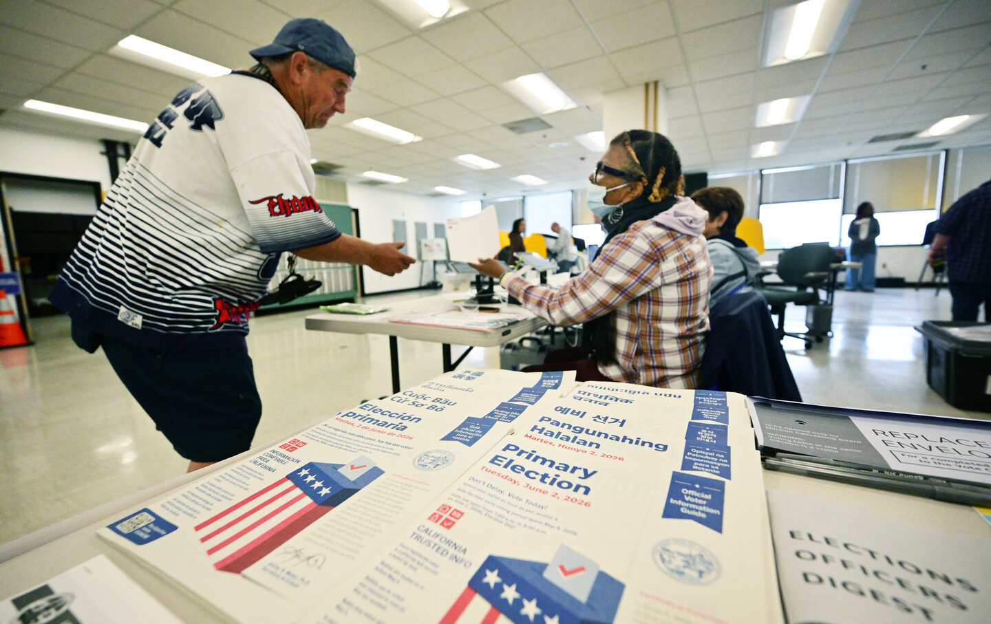 A man checks in to vote at a polling location at the Los Angeles County Registrar during early voting in the state's primary election.
