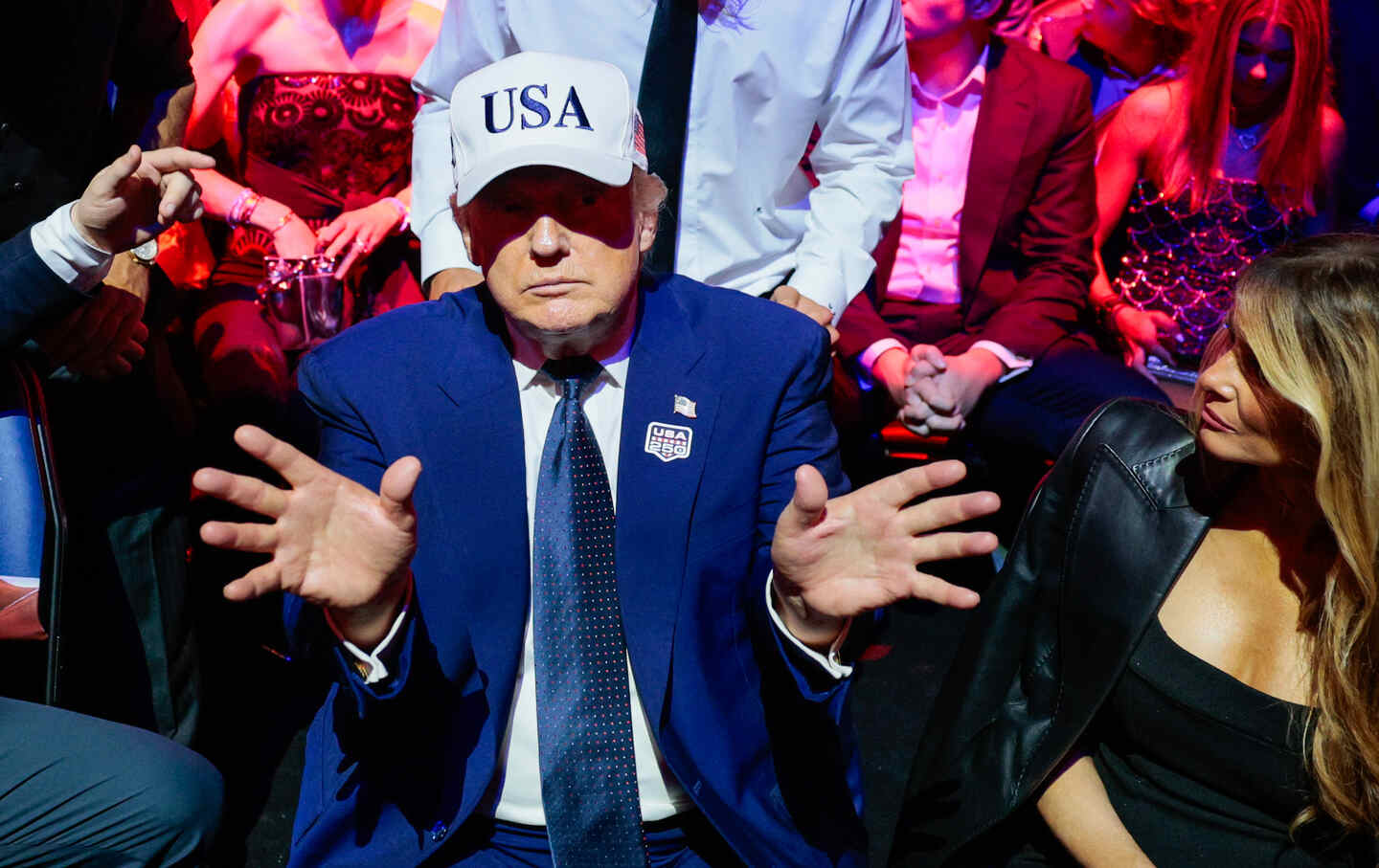 President Donald Trump gestures next to first lady Melania Trump during UFC Freedom 250 on the South Lawn of the White House.