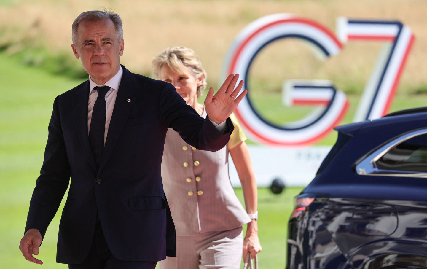 Canada's Prime Minister Mark Carney and his wife, Diana Fox Carney, arrive to attend the G7 summit, in Évian, eastern France.