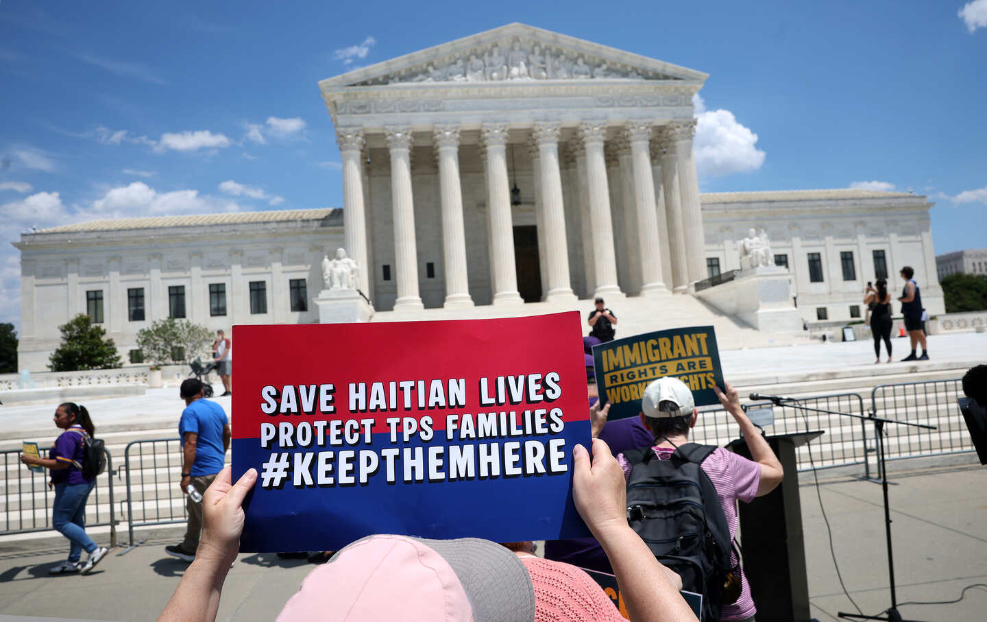 Immigration activists rally against the US Supreme Court's ruling on temporary protective status on June 25, 2026 in Washington, DC.