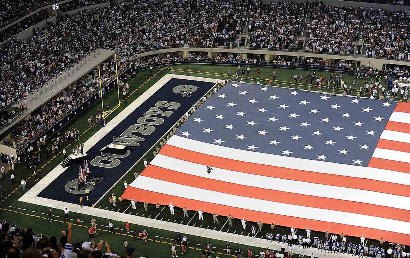A view of the U.S. flag on the field during the national anthem before a game between the New York Giants and the Dallas Cowboys at Cowboys Stadium in Arlington, Texas, on September 20, 2009.