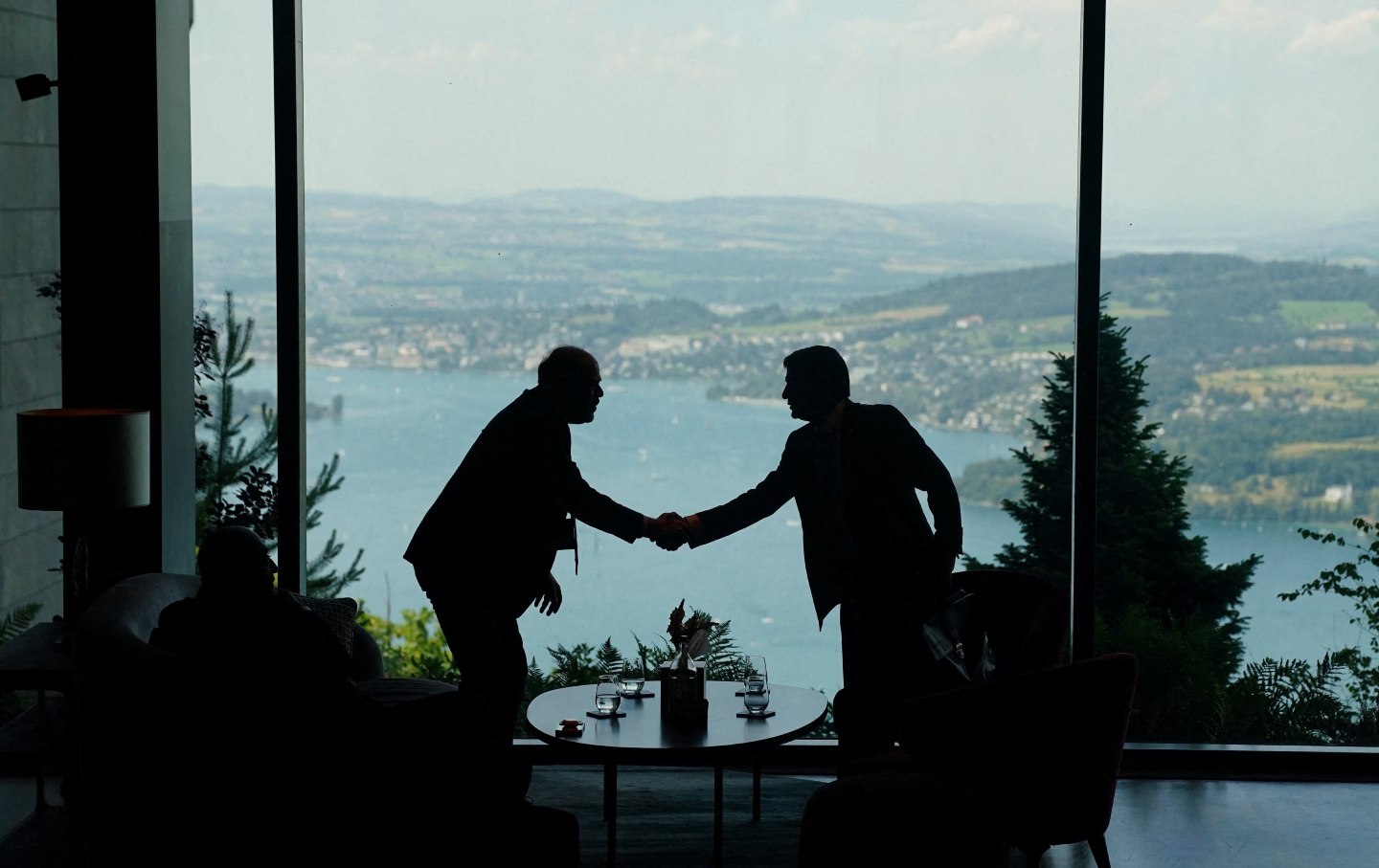 Delegation staff members meet in the lobby on June 21, 2026, for a quadrilateral meeting between the United States, Iran, Pakistan, and Qatar at the Burgenstock luxury hotel complex overlooking Lake Lucerne, Switzerland.